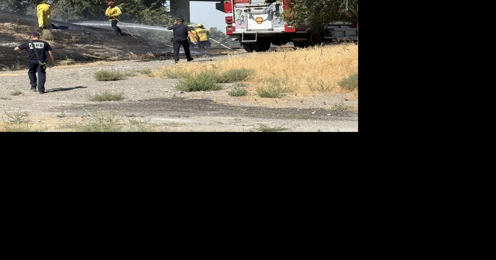 Man taken into custody in connection to grass fire near busy Kennewick road and highway
