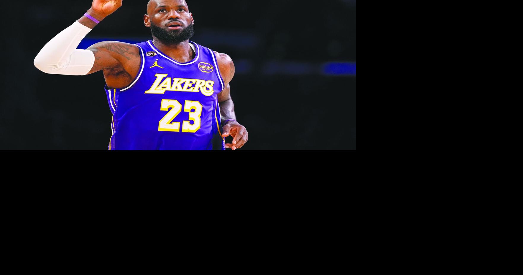 James has triple-double in win over Mavericks