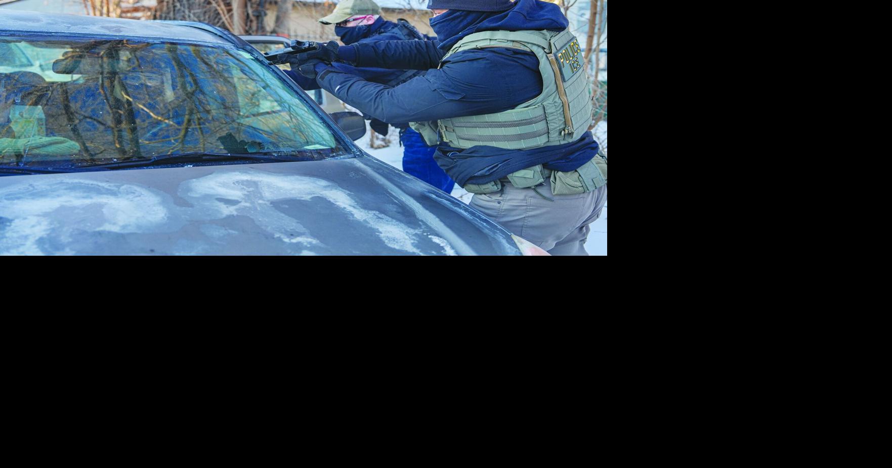 ICE agents draw guns, arrest activists