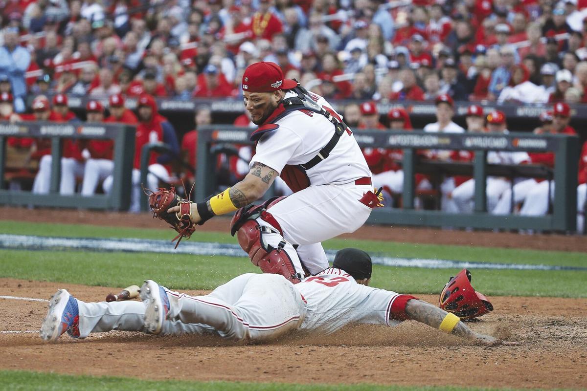 Philadelphia Phillies' Jean Segura is hit by a pitch during the fifth  inning in Game 2 of a National League wild-card baseball playoff series  against the St. Louis Cardinals, Saturday, Oct. 8