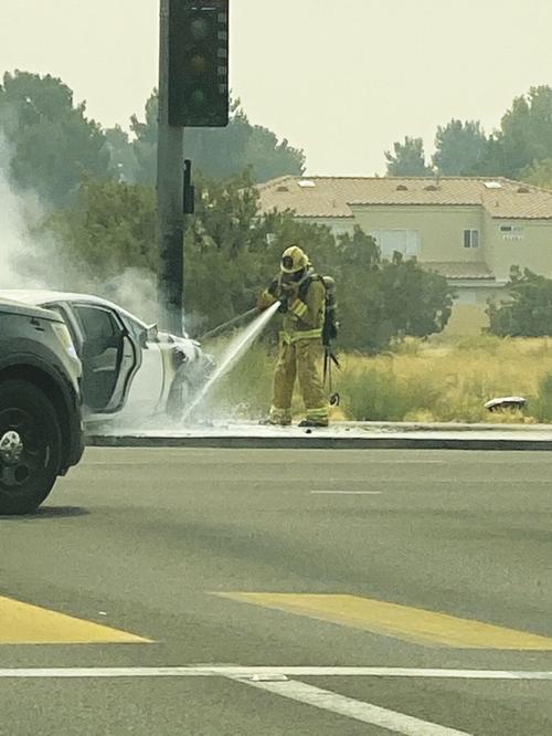 Car hits pole, catches fire