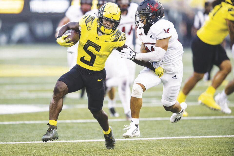 Lids Justin Herbert Oregon Ducks Fanatics Authentic Unsigned Yellow Jersey  Running with Ball vs. Arizona State Photograph