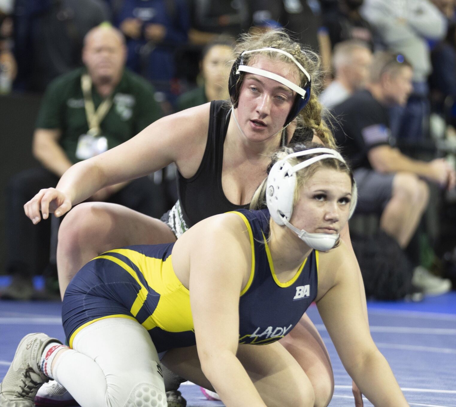 Six area wrestlers reach semifinals with 13 others in contention