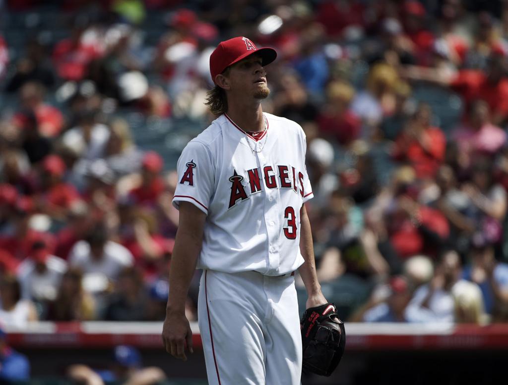 Pitcher Nolan Ryan of the California Angels sits in the dugout during