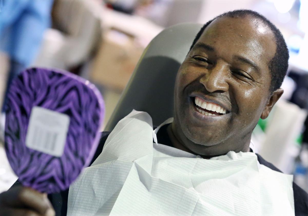 Smile! Pro bono dentists brighten outlooks with free clinic News