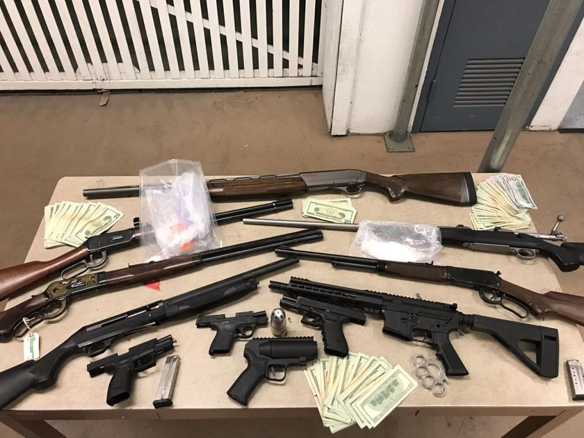 4 arrested after search warrants yield trove of drugs, guns and cash