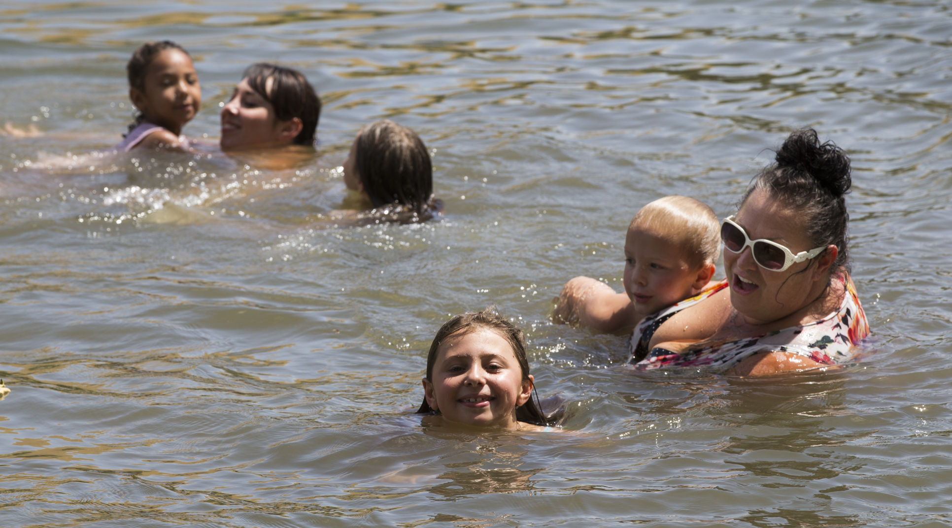 Parents talk water safety while visiting Kern River Hart Park Lake