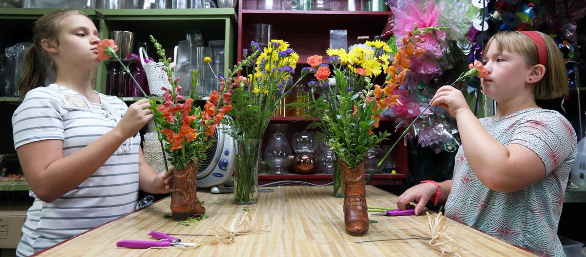 Kids Get A Kick Out Of Creating Flower Arrangements In Ceramic