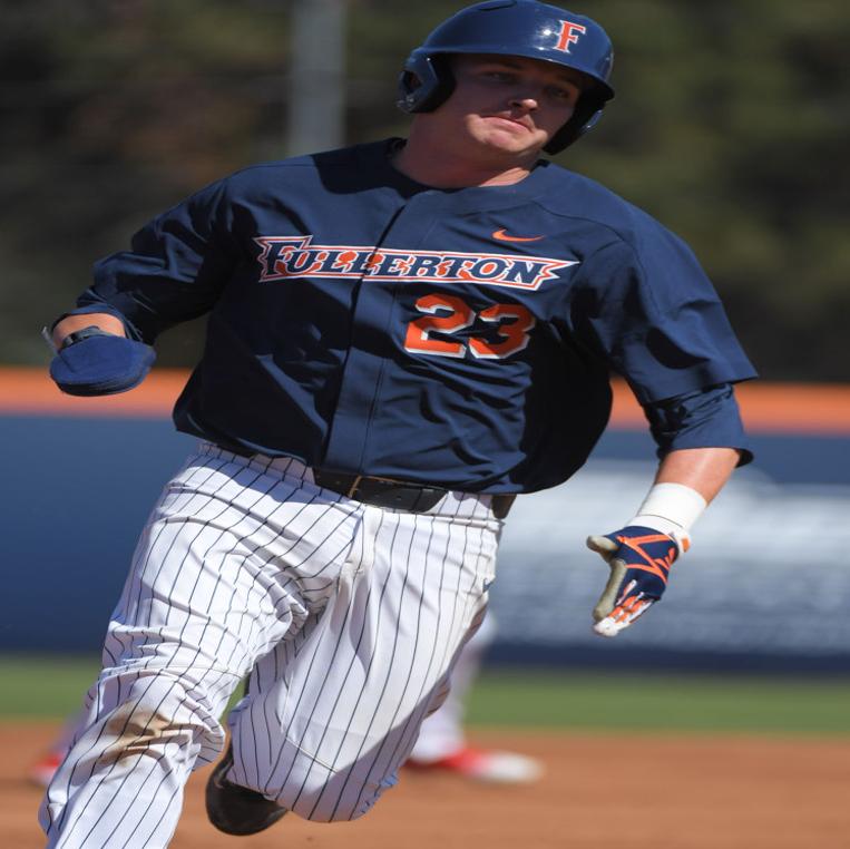 Jake Pavletich #23 of the Cal State Fullerton Titans takes a throw