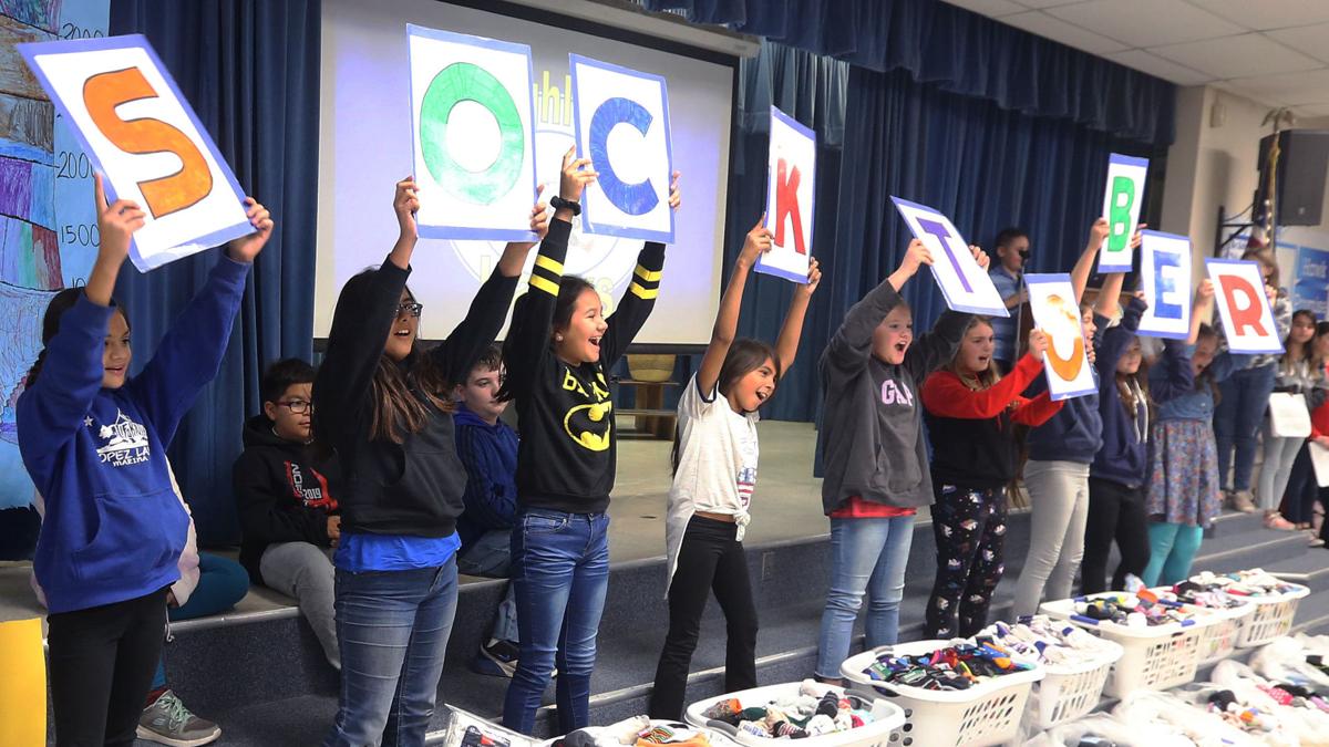 PHOTO GALLERY Highland Elementary donates over 4,000 pairs of socks to
