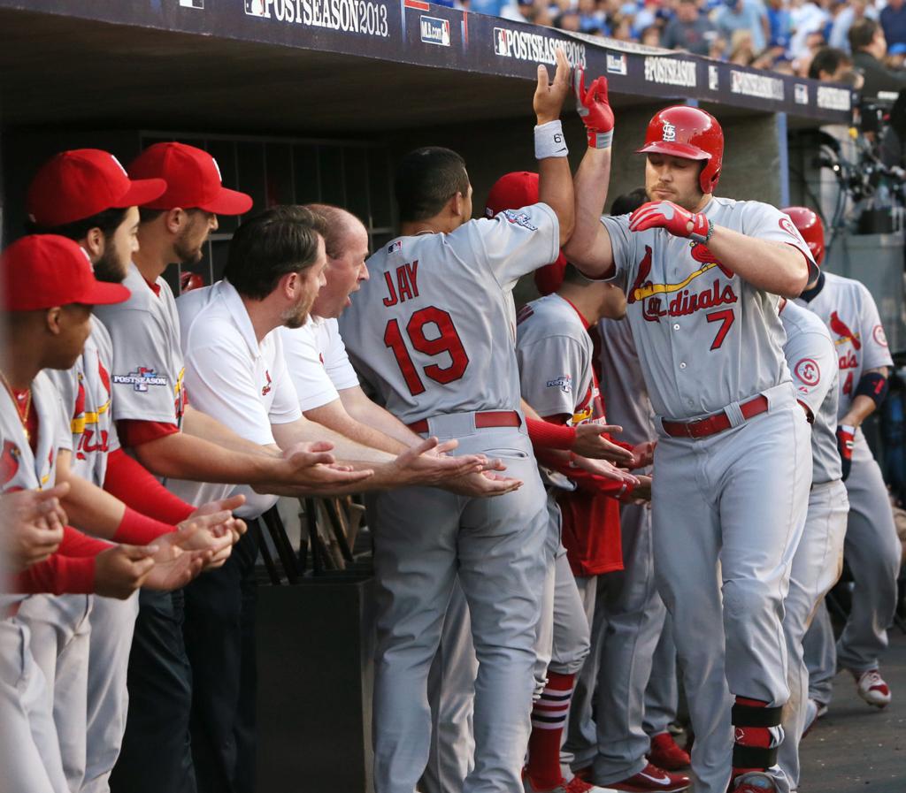 Jon Jay of the St. Louis Cardinals, left, celebrates with teammate