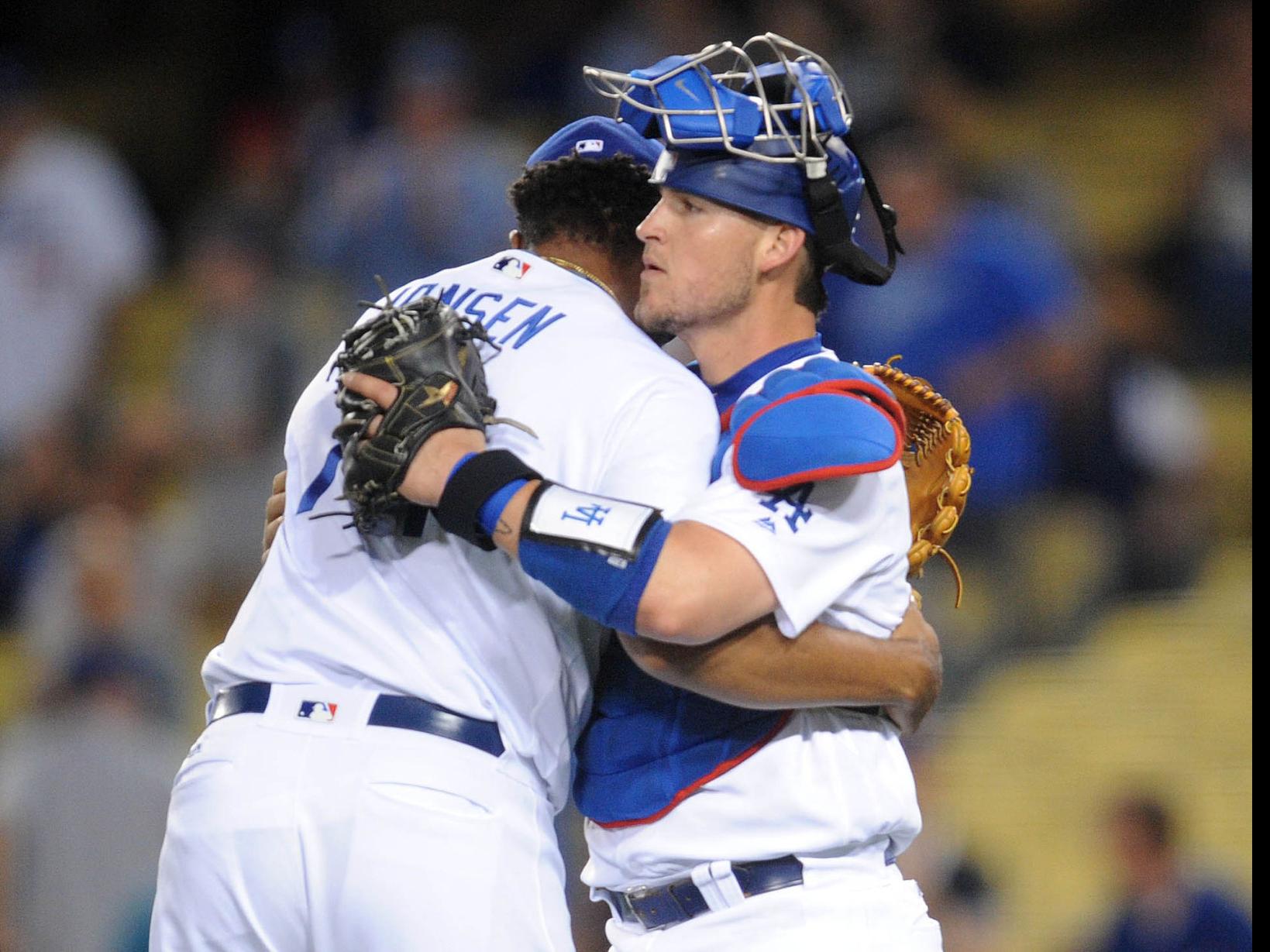 Los Angeles Dodgers' Yasmani Grandal, left, and Chase Utley, right
