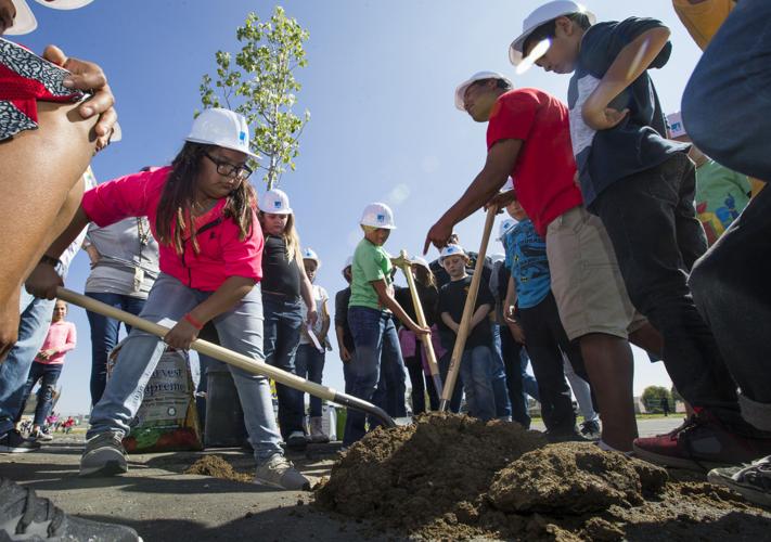 Eissler Elementary students help plant three new trees to bring shade