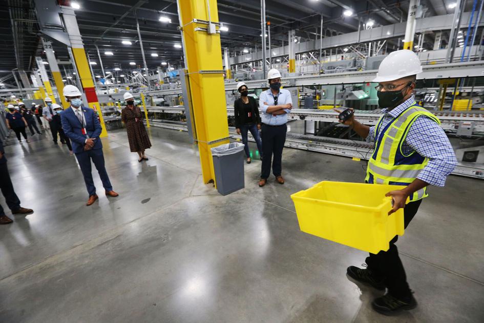 Amazon unveils distribution center, begins mass hiring