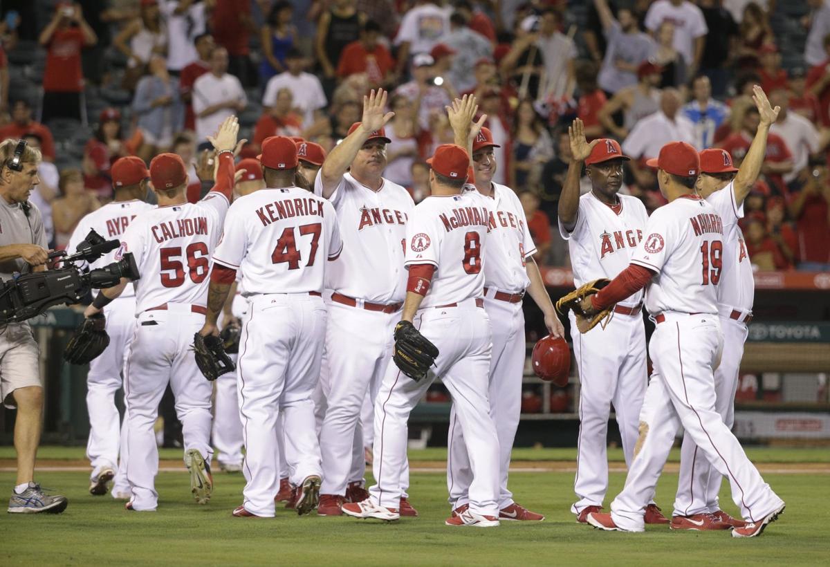 Angels clinch playoff spot in win over Mariners