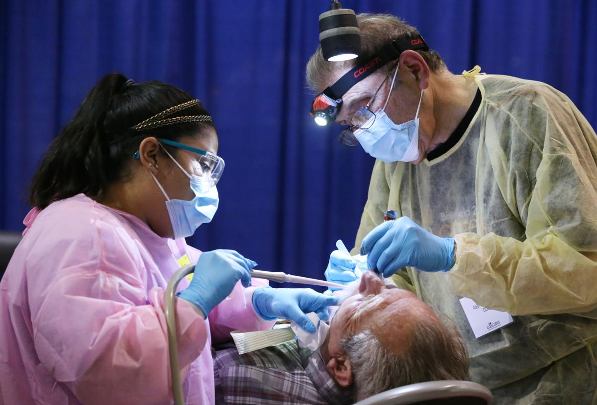 Smile! Pro bono dentists brighten outlooks with free clinic News