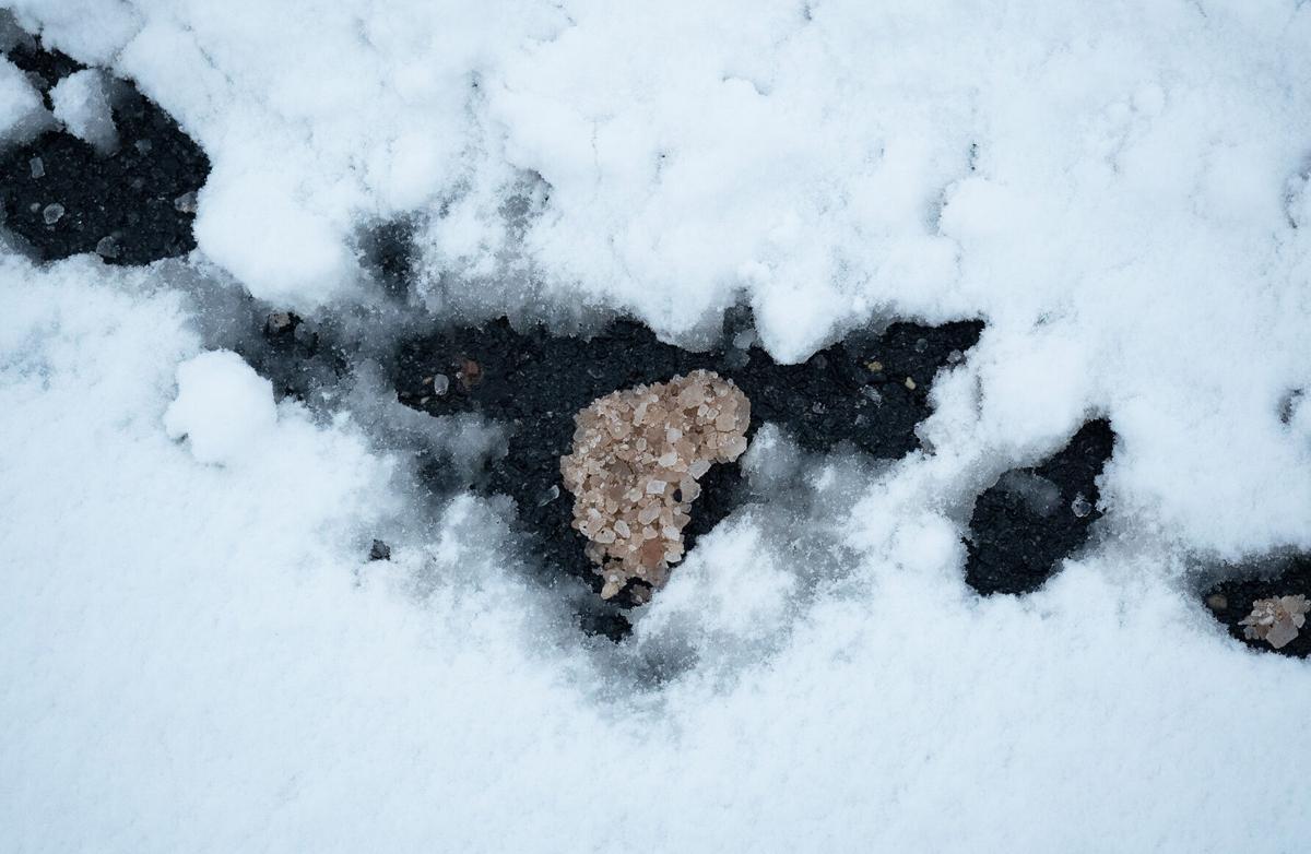 Road salt melting in snow