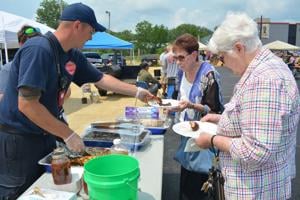 Firefighters fire up grills at Rib Fest