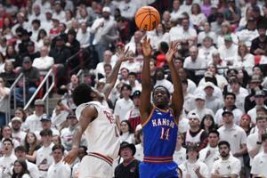 Peterson hits two late 3s as No. 11 Kansas wins 64-61 at No. 13 Texas Tech