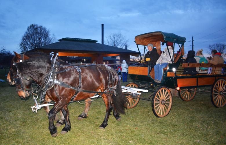 Kids enjoy carriage rides, gifts and time with Santa at Beloit's Heroes