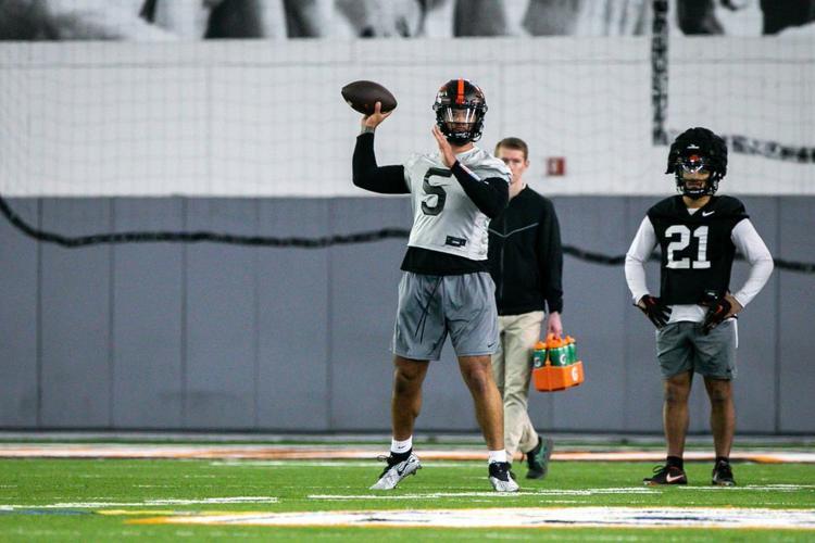 Transfer quarterback DJ Uiagalelei (#5) throws as the Oregon State Beavers open spring football practice in Corvallis, Oregon on Tuesday, March 7, 2023.