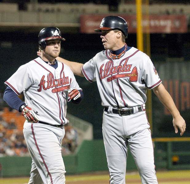 Atlanta Braves' Sid Bream, right, is congratulated by Braves' John