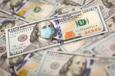 Pile of One Hundred Dollar Bills With Medical Face Mask on Face of Benjamin Franklin (copy)