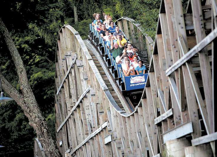 Screaming through the trees on a wooden roller coaster