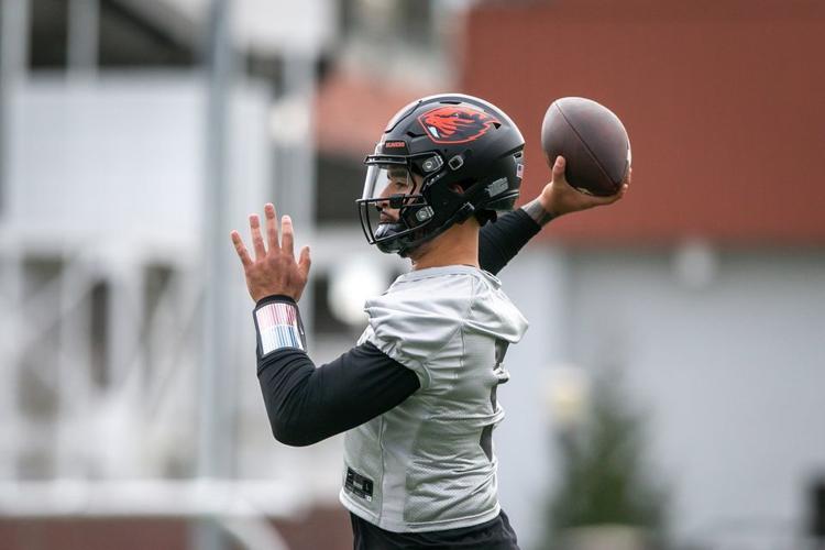 Transfer quarterback DJ Uiagalelei (#5) throws as the Oregon State Beavers open spring football practice in Corvallis, Oregon on Tuesday, March 7, 2023.