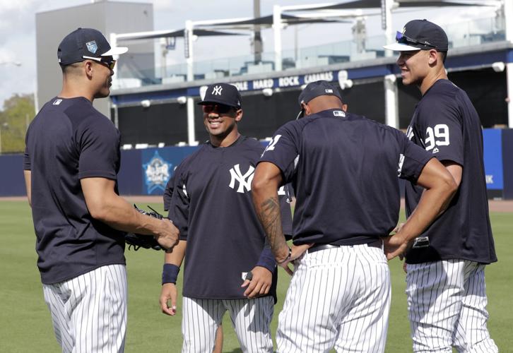 Pinstripe passer: Russell Wilson works out with Yankees