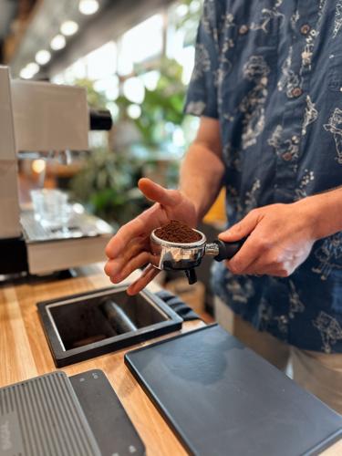 Barista prepares a shot of espresso.JPG