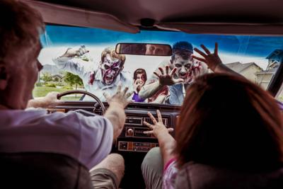 Zombies attacking car