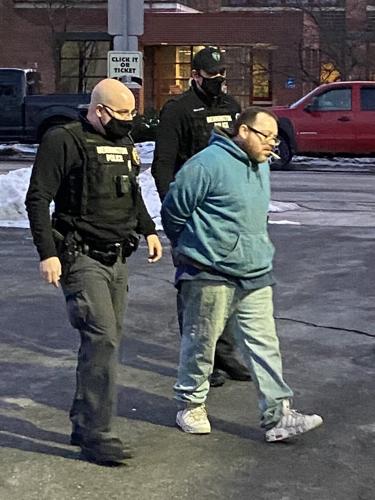 Grant G. Bentley is walked into Bennington Police Station after arrest on hit-and-run-charges