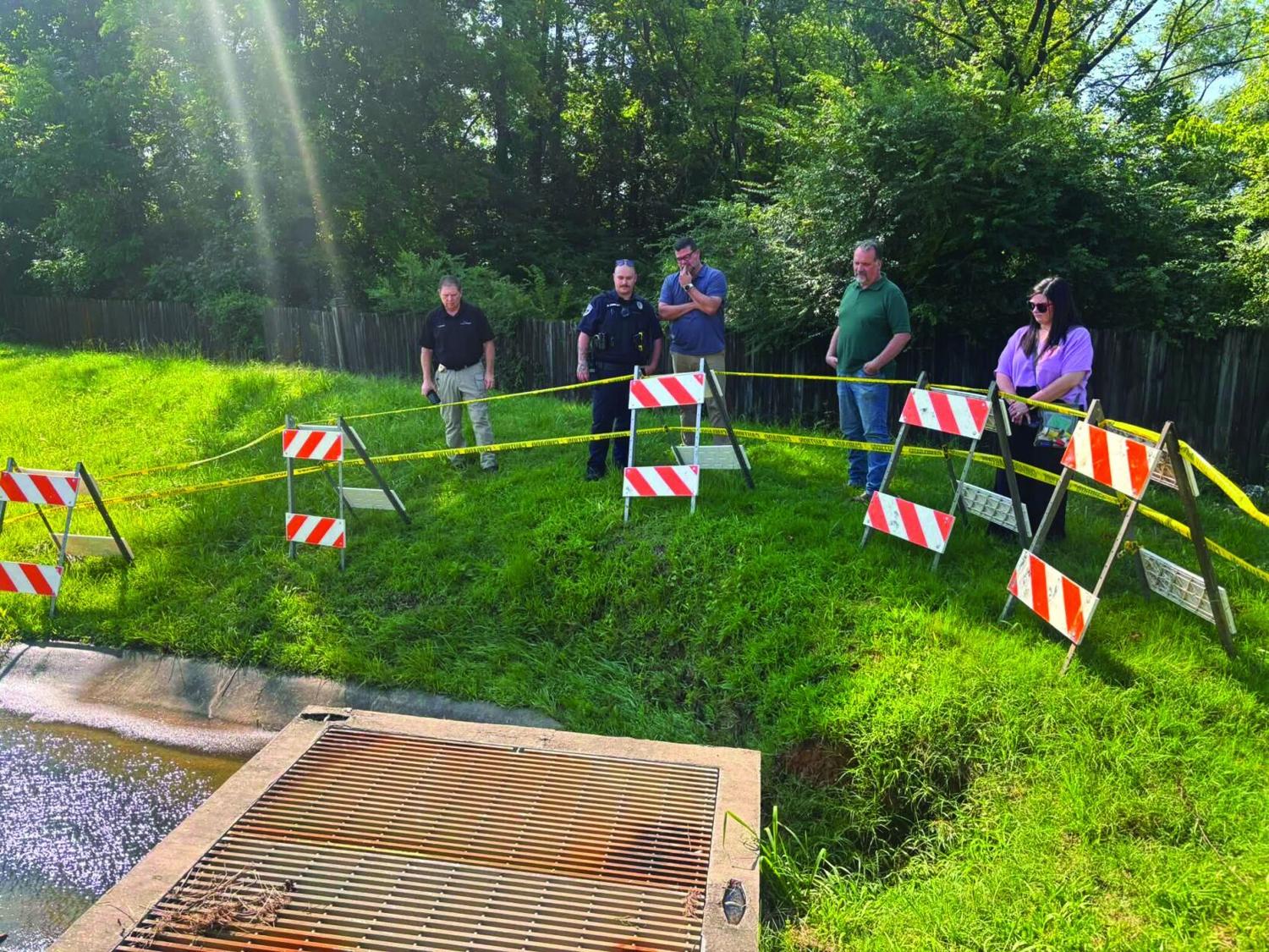 Police report details rescue of Bryant girl swept into drain; city to fence off basin over maintenance gaps