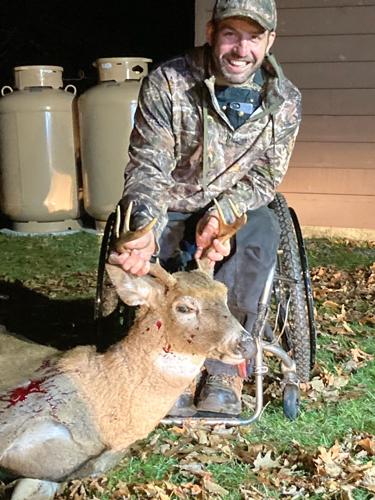 paraplegic hunter with deer