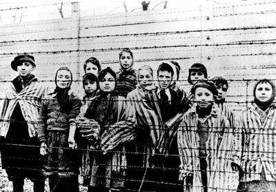Auschwitz children behind barbed wire