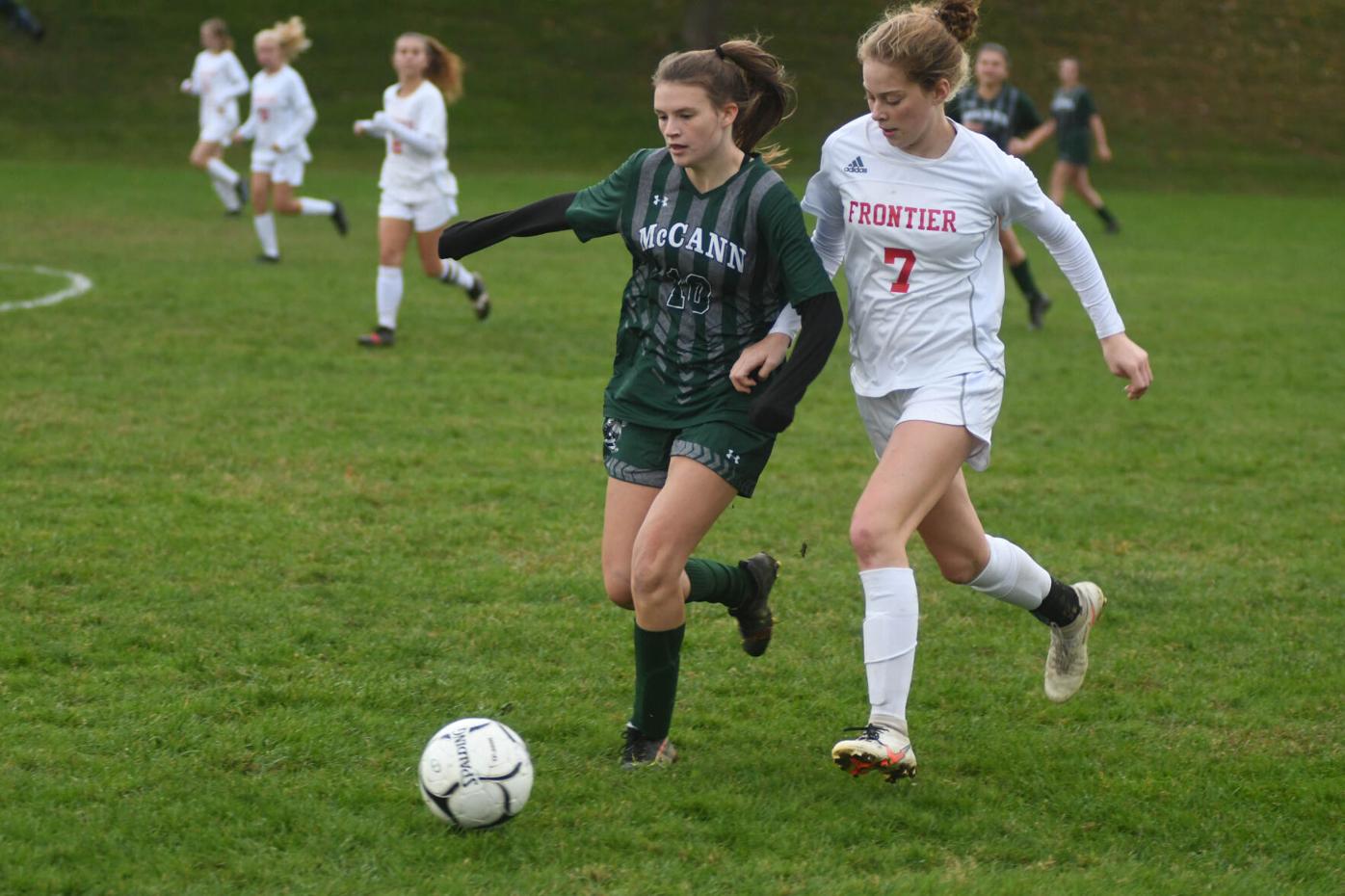 Two players fight for the ball