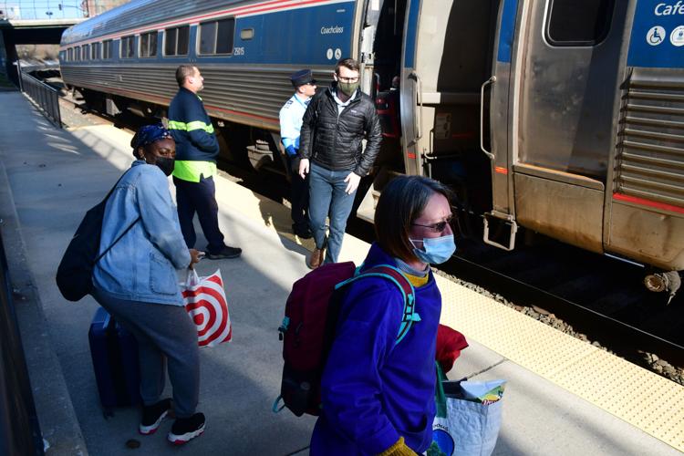 Passengers disembark and load onto an Amtrak train.