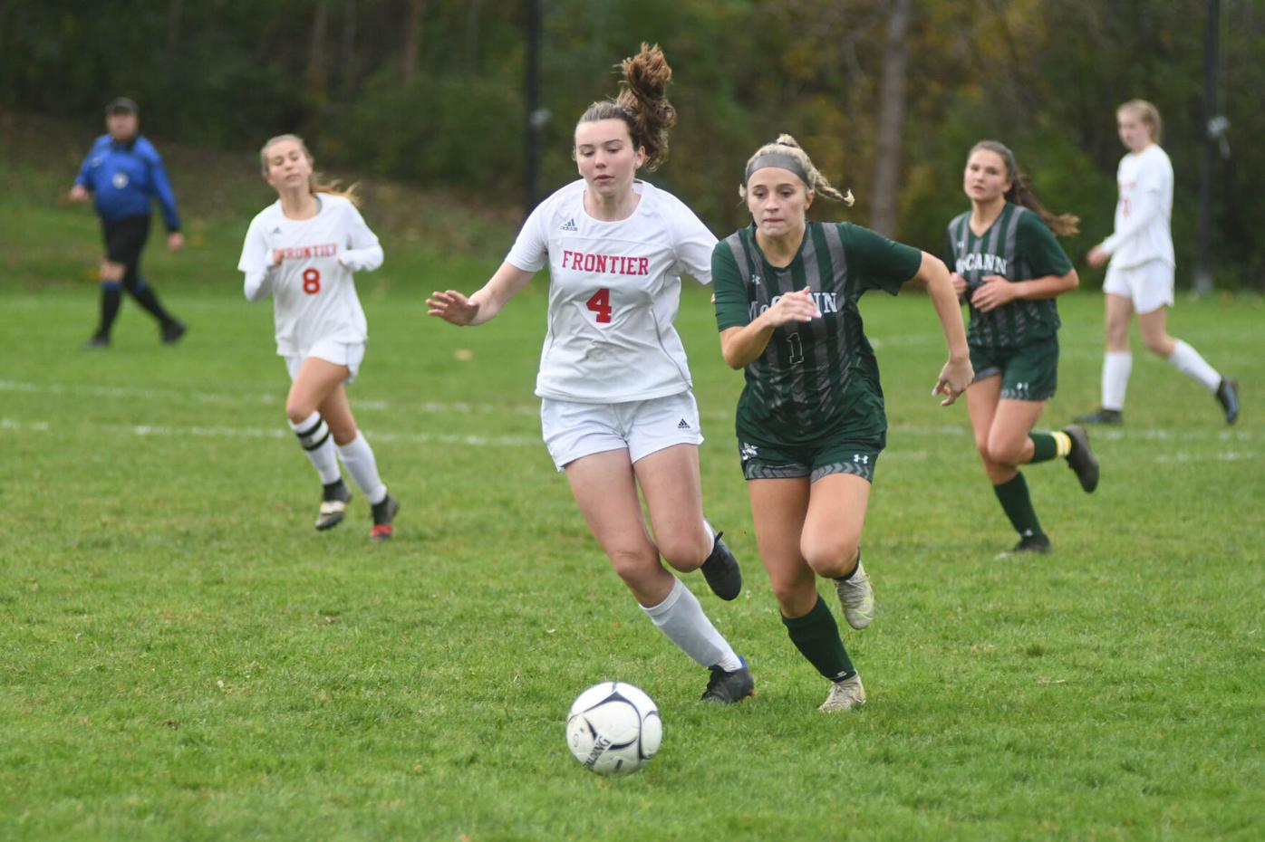 Two players fight for the ball