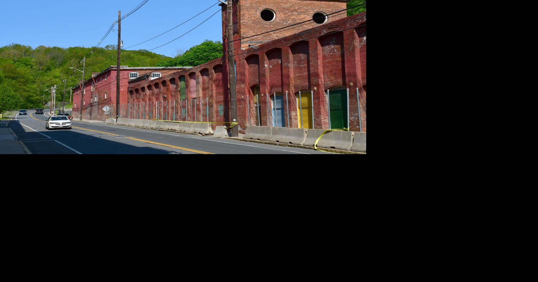 The sidewalk outside this North Adams mill building has been closed for