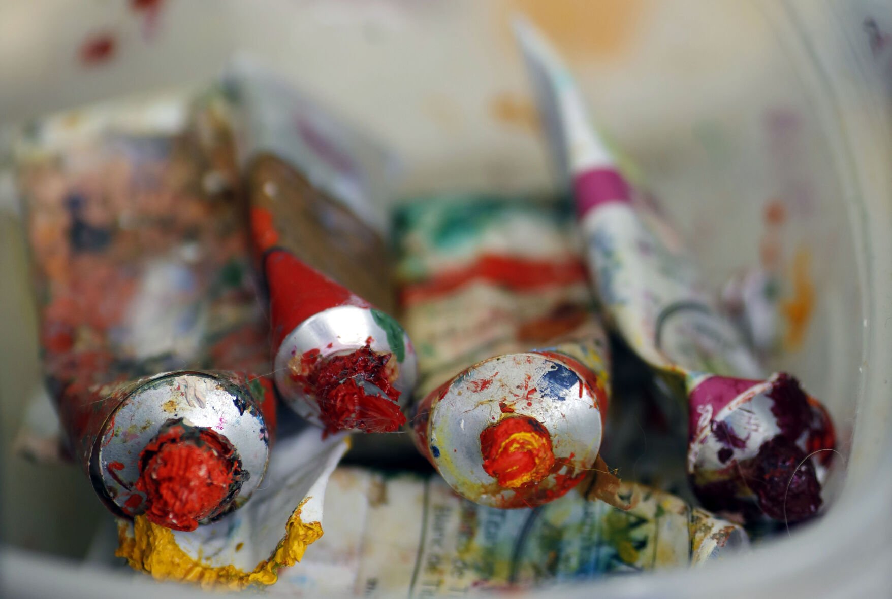 container with bright oil paints inside