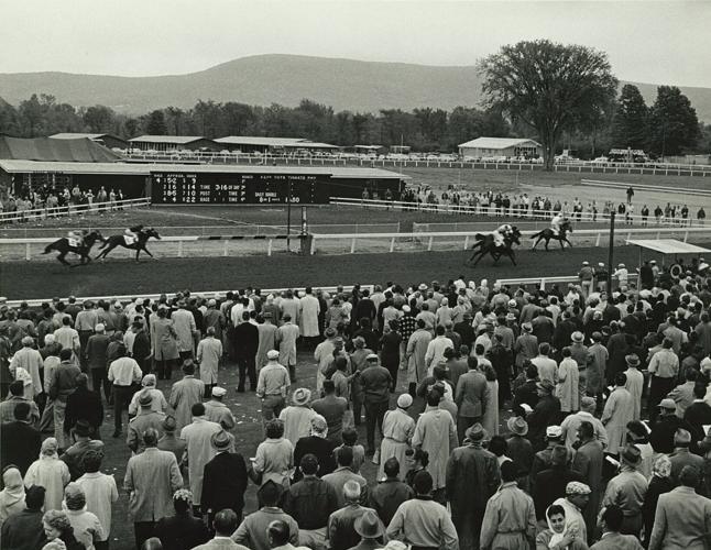 The crowd watches a race at Berkshire Downs, September 1960