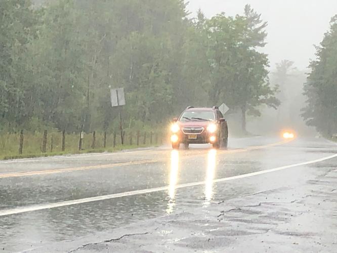 Car driving through rain