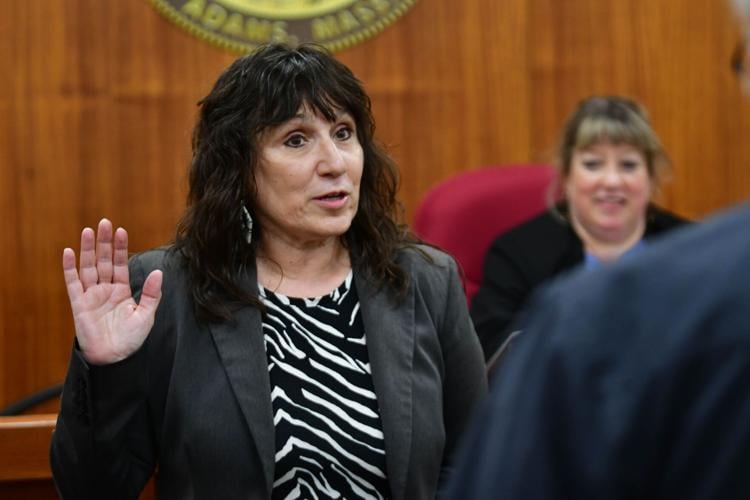 A woman is sworn in