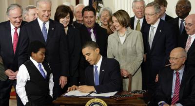 Obama signs with left hand