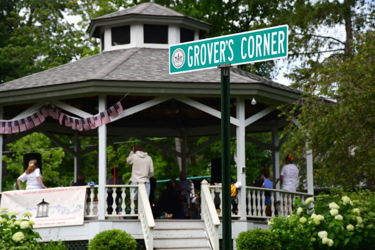 The sign "Grover's Corner," with the gazebo in the background