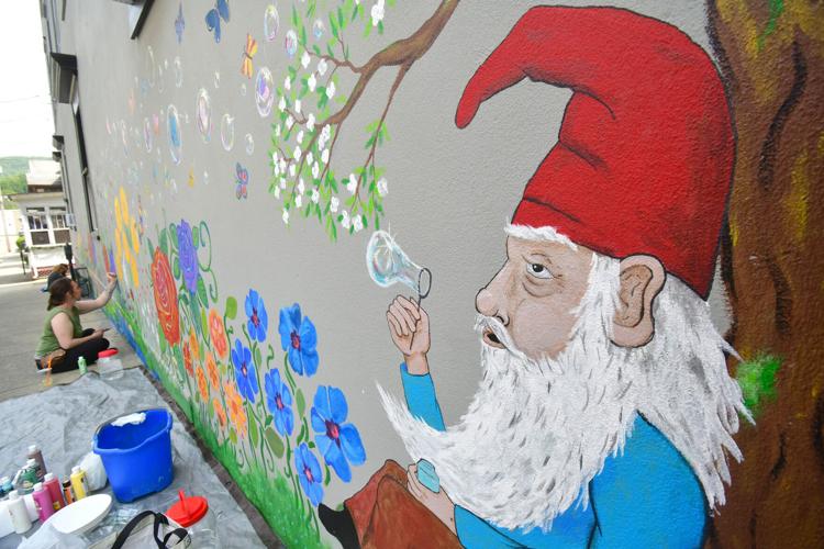 Photos: Artists paint a mural on a building wall in Adams | Multimedia