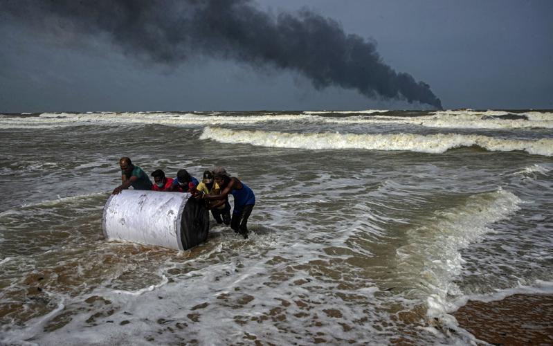 People salvage debris