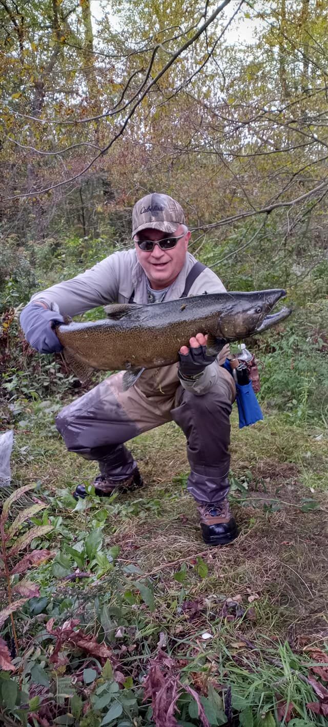 Ron Wojcik holds a fish