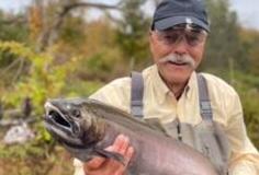 bill travis holds a fish